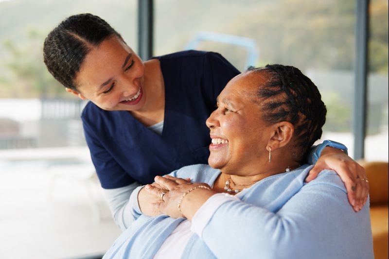 Carer supporting an older adult